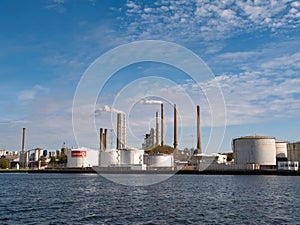 Tanks and stacks of Circle K oil and gas terminal along Limfjord in Aalborg, Nordjylland, Denmark