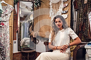 Tanned Caucasian female with fierce posing at an amusement park