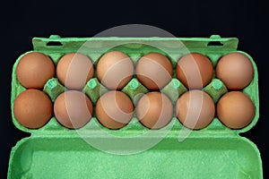 Tanned Hens Eggs in a Green Punnet