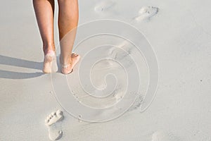 Tanned legs on the beach