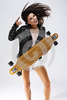 Tanned Positive Caucasian Brunette Girl In Black Leather Jacket