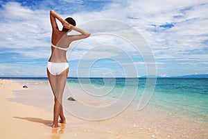 Tanned woman on the beach