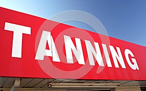 Tanning Sign on Convenience Store