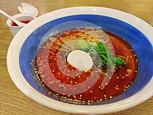 Tantan-men or Dandan noodles, ramen with spicy sauce containing preserved vegetables, chili oil, Sichuan pepper, minced pork, egg