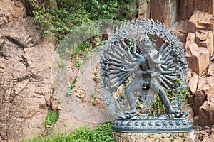 Tantric Deities statue in Ritual Embrace located in a mountain g