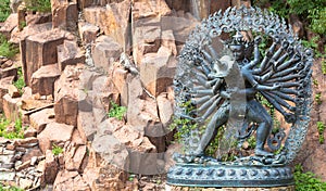 Tantric Deities statue in Ritual Embrace located in a mountain g