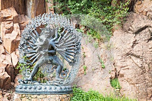 Tantric Deities statue in Ritual Embrace located in a mountain g