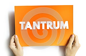 Tantrum - is an emotional outburst, usually associated with those in emotional distress, text concept on card