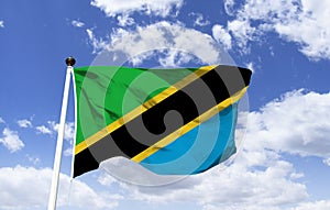 Tanzanian Flag Mockup, fluttering under the blue sky