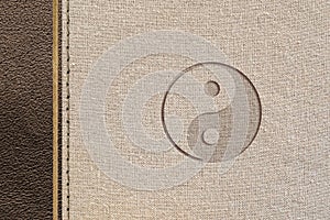 Taoist philosophy design with leather and fabric with yin-yang engraved photo