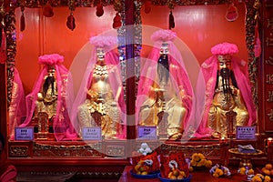 Taoist shrine with images of key deities including Cai Shen, Yao Wang, Hua Tuo and Tai Sui, seen here at a Thai Chinese temple