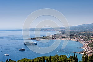 Taormina Bay in a summer day seen from greek theater in Taormin