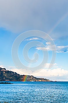 Taormina cape and rainbow in Ionian Sea in spring