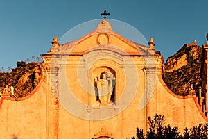 Taormina - First morning sun beams on square Piazza IX Aprile at sunrise in Taormina, Province of Messina, Sicily photo