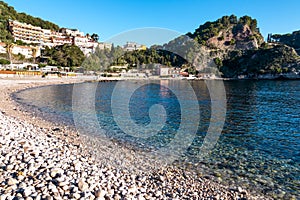 Taormina - Panoramic view from beach Spiaggia di Isola Bella on Grotta Azzurra peninsula in Taormina, Sicily, Italy, Europe, EU.