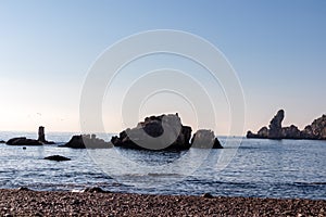 Taormina - Panoramic view on rock formation seen from beach Spiaggia di Isola Bella in Taormina, Sicily, Italy, Europe, EU.