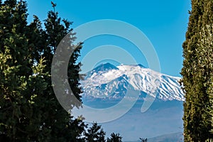 Taormina - Panoramic view of snow capped Mount Etna volcano from Taormina, Sicily, Italy, Europe, EU