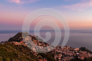 Taormina - Panoramic view during sunset on the tourist village of Taormina, Sicily, Italy