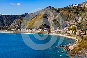 Taormina shore at Ionian sea with Castello Saraceno, Giardini Naxos and Villagonia towns in Messina region of Sicily in Italy