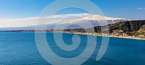 Taormina shore at Ionian sea with Giardini Naxos and Villagonia towns and Mount Etna in Messina region of Sicily in Italy