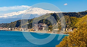 Taormina shore at Ionian sea with Giardini Naxos and Villagonia towns and Mount Etna in Messina region of Sicily in Italy