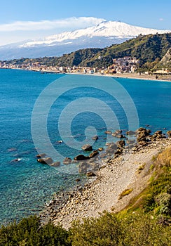 Taormina shore at Ionian sea with Giardini Naxos and Villagonia towns and Mount Etna volcano in Messina region of Sicily in Italy