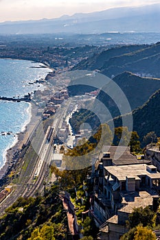 Taormina shore at Ionian sea with Giardini Naxos and Villagonia towns and Mount Etna volcano in Messina region of Sicily in Italy