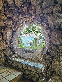 Taormina, Sicily, Italy. Stone bench carved on the rocks of Isola Bella island