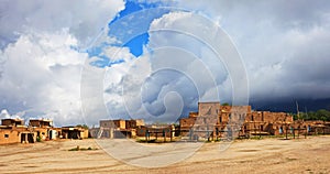 Taos Pueblo with dramatic clouds, New Mexico