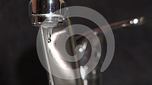 Tap dripping in kitchen with sound