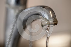 Tap limescale. Selective focus on the hard water deposit of a ru photo