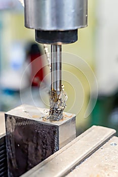 A tap on a machine for tapping a hole in a part