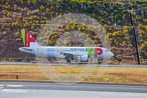 TAP Portugal Airbus A319-111 lands at Funchal Cristiano Ronaldo Airport.This airport is one of th