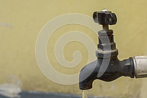 A tap with running water concept of water wastage