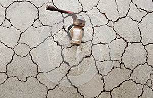 Tap water on a cracked wall