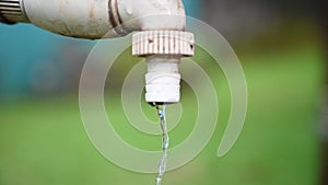 Tap water dripping wastage, falling potable water drop, pure water conservation