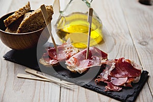 Appetizer Serrano ham with toasted bread