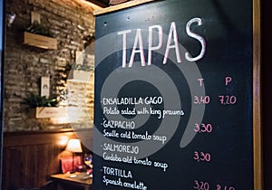 Tapas bar in Spain. Spanish tapas bar in historical center of Seville at night