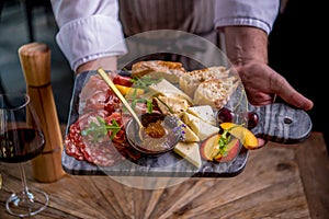 Tapas on plate in chefs hands