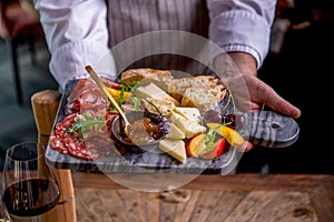 Tapas on plate in chefs hands