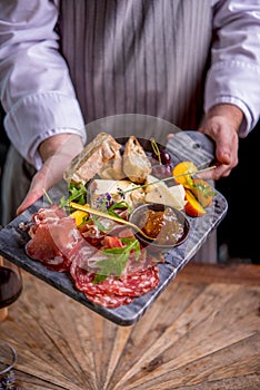 Tapas on plate in chefs hands