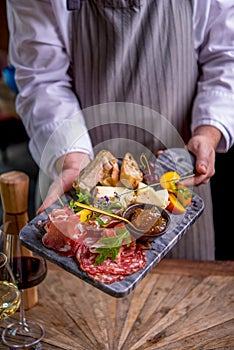 Tapas on plate in chefs hands