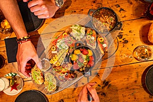 Tapas platter on a table being eaten