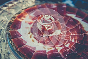 Iberian ham dish of circular shape photo