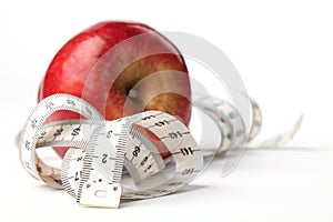 Tape measure and apple