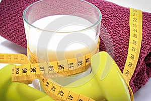 Tape measure, glass of milk and accessories using in fitness. Slimming, healthy sporty lifestyles