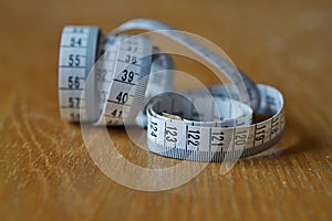 Tape measure measuring length in centimeters and meters, frequently used for measuring the perimeter of human body during the die