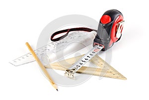 Tape measure, pencil and ruler on a white background. Closeup