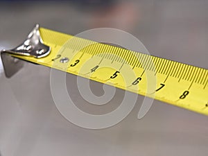 Tape measure, scale. construction tool for measuring length.