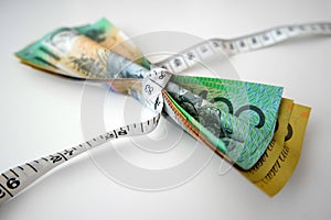 Tape measure tightly wrap Australian banknotes